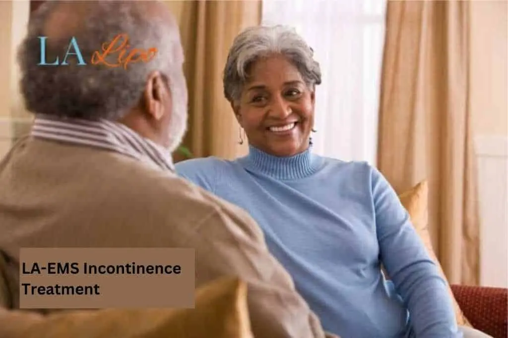 Couple sat smiling at each other - LA-EMS treatment Liverpool